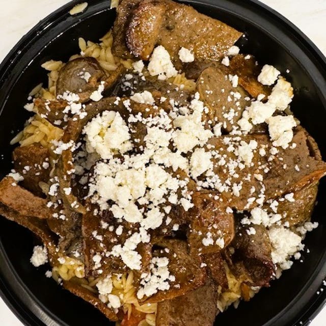 Seven Slices of Gyro Meat Over Orzo with Feta.
